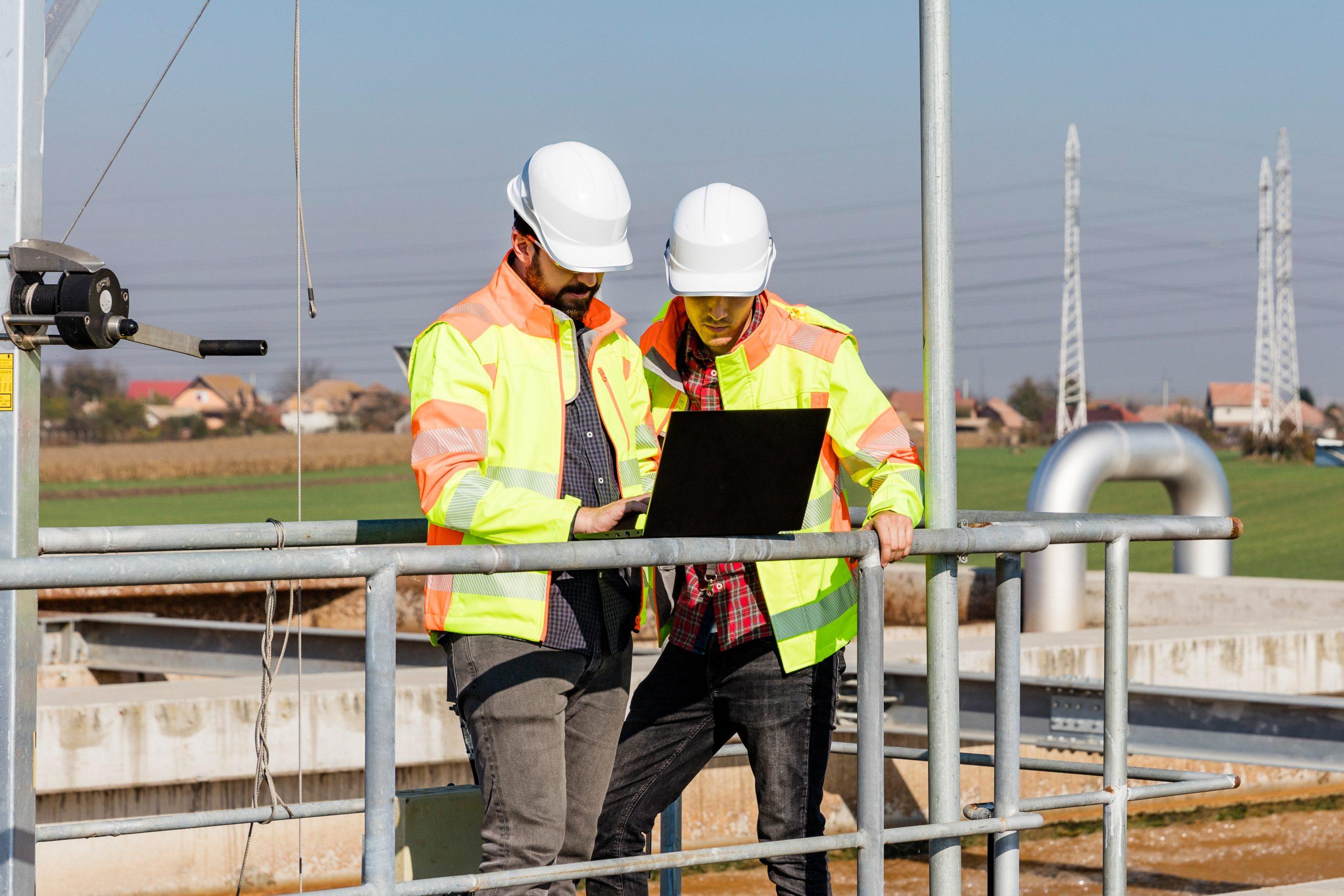 Construction workers using computer